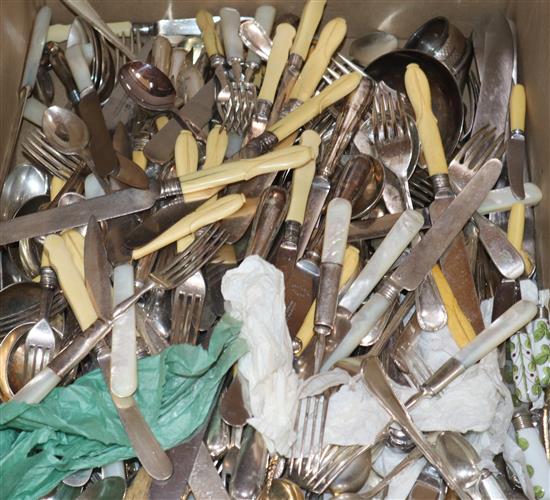 A large collection of plated cutlery, including a soup ladle, a cheese scoop, carving implements etc.